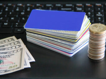 credit-cards-and-coins-pile-with-fifty-dollar-bill-2025-01-16-11-17-34-utc