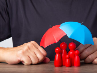 Hand holding umbrella and cover family.